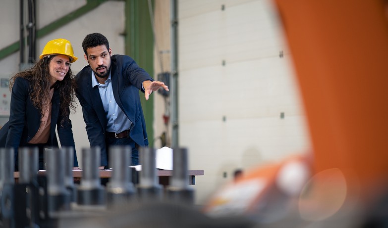 man-engineer-showing-machines-to-his-collegue