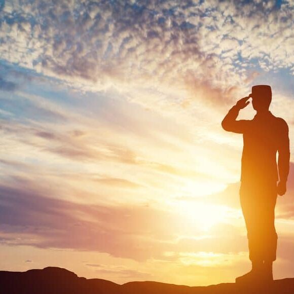 Soldier saluting. Sunset sky, sun shining. Army, salute, patriotic concept. 3D illustration